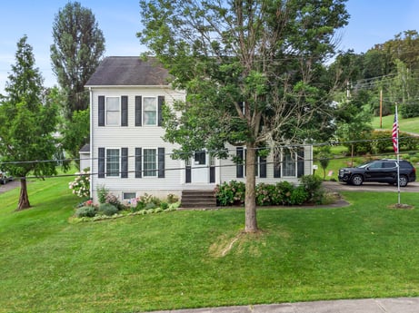 An image featuring plant, property, sky, building, tire, wheel, window, tree, house, vehicle at 105 Thomas St.