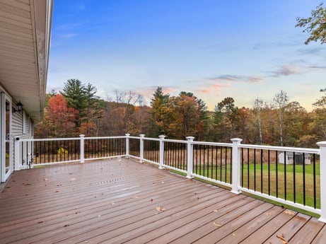 An image featuring cloud, sky, plant, building, wood, fence, tree, natural landscape, grass, porch at 74 Susquehannock Trail.