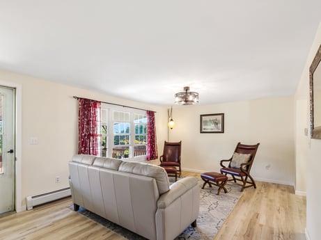 An image featuring picture frame, furniture, building, wood, flooring, interior design, comfort, living room, floor, hall at 62 Leons Rd.