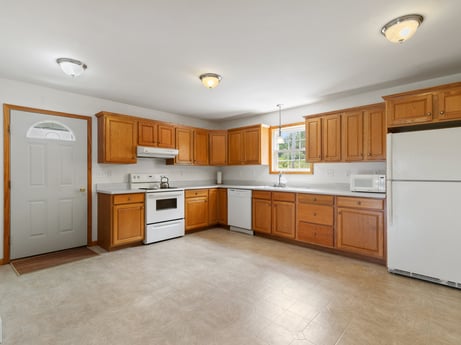 A kitchen at 2899 Overton Rd featuring: countertop, cabinetry, furniture, property, building, drawer, kitchen, wood, kitchen appliance, chair