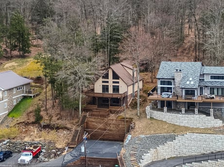 An image featuring property, building, window, wood, plant, tree, house, neighbourhood, residential area, tire at 815 Lakeside Dr.