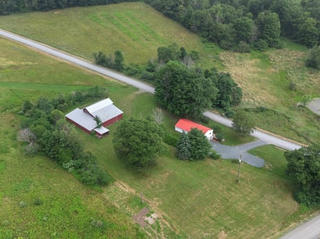 An image featuring property, ecoregion, plant, natural landscape, land lot, slope, house, biome, grassland, tree at 353 Bidlack Rd.