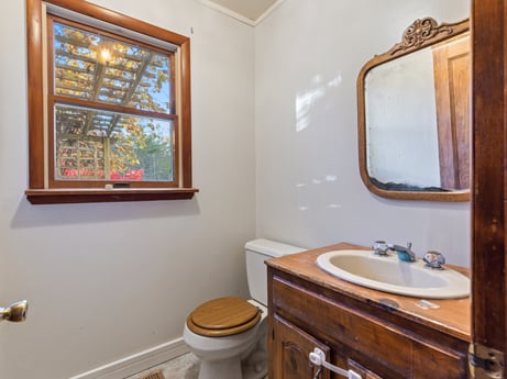 An image featuring mirror, brown, bathroom cabinet, plumbing fixture, tap, sink, property, bathroom sink, makeup mirror, bathroom at 2266 Liberty Corners Rd.