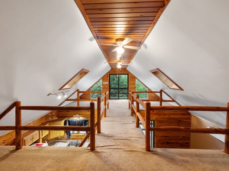 An image featuring wood, interior design, stairs, floor, flooring, real estate, wood stain, hardwood, symmetry, house at 121 Marcy Rd.