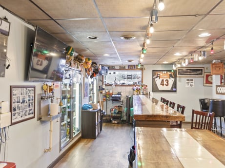 An image featuring picture frame, building, flooring, retail, ceiling, wood, shelf, event, shelving, hardwood at 199 State St.
