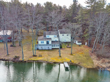 An image featuring water, plant, window, tree, lake, house, natural landscape, watercourse, building, cottage at 199 S Lake Rd.