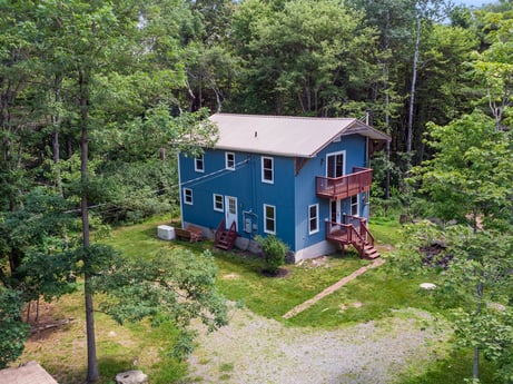 An image featuring plant, window, building, tree, wood, land lot, cottage, natural landscape, house, grass at 145 Nichols Ln.