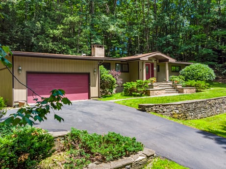 An image featuring plant, building, green, tree, land lot, architecture, shade, grass, cottage, road surface at 104 Stony Mountain Rd.