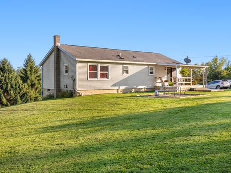 An image featuring sky, plant, property, building, window, house, tree, land lot, door, grass at 62 Leons Rd.