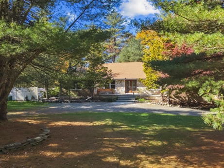 An image featuring plant, cloud, building, sky, window, shade, natural landscape, tree, road surface, grass at 125 Rimstone Ct.