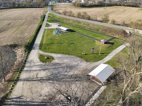 An image featuring plant, ecoregion, slope, land lot, urban design, grass, asphalt, landscape, road surface, grassland at River Access Rd.
