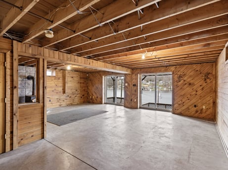 An image featuring window, hall, wood, building, fixture, beam, flooring, wood stain, hardwood, plank at 815 Lakeside Dr.