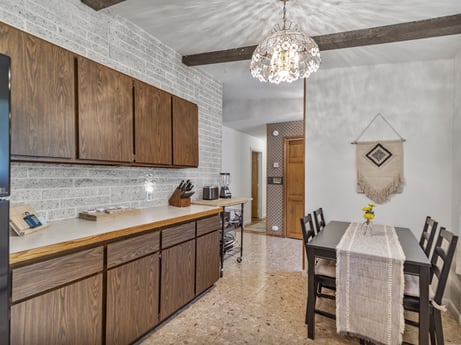 A kitchen at 104 Stony Mountain Rd featuring: cabinetry, property, furniture, countertop, table, wood, kitchen, sink, interior design, grey