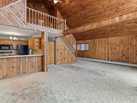 An image featuring building, cabinetry, wood, interior design, house, flooring, floor, wood stain, beam, hall at 815 Lakeside Dr.