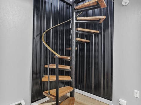 An image featuring building, wood, floor, door, flooring, hardwood, rectangle, shelving, wood stain, art at 104 Stony Mountain Rd.