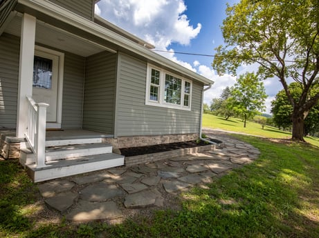 An image featuring plant, building, cloud, window, sky, tree, house, wood, land lot, shade at 17899 US-6.
