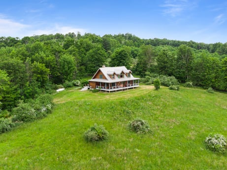 An image featuring cloud, sky, plant, building, tree, natural landscape, house, highland, mountain, cottage at 1761 Brick House Rd.