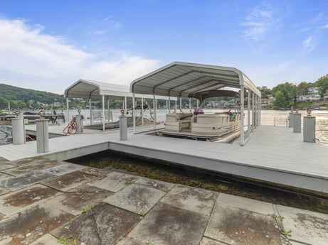 An image featuring cloud, sky, shade, plant, urban design, road surface, leisure, residential area, tree, landscape at 218 Point Rd.