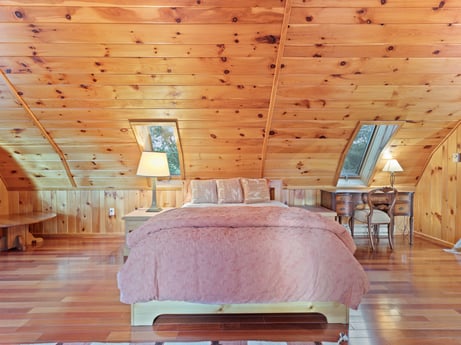 An image featuring furniture, property, wood, building, comfort, interior design, flooring, wood stain, floor, leisure at 130 Haighs Pond Rd.