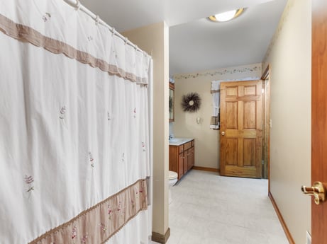 An image featuring fixture, building, door, wood, cabinetry, interior design, floor, house, flooring, real estate at 74 Susquehannock Trail.