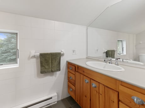 An image featuring mirror, bathroom cabinet, tap, sink, cabinetry, bathroom sink, plumbing fixture, building, bathroom, wood at 130 Haighs Pond Rd.