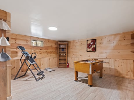 An image featuring table, furniture, building, tripod, wood, flooring, house, wood stain, floor, ladder at 125 Rimstone Ct.