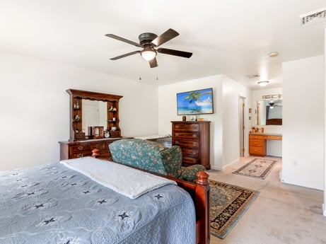 An image featuring picture frame, property, furniture, ceiling fan, cabinetry, azure, wood, building, lighting, comfort at 105 Thomas St.
