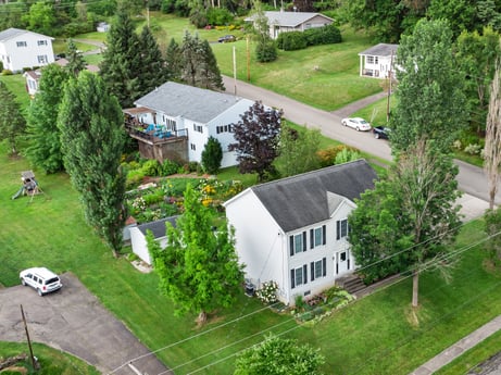 An image featuring plant, building, property, green, tree, window, house, land lot, urban design, vehicle at 105 Thomas St.