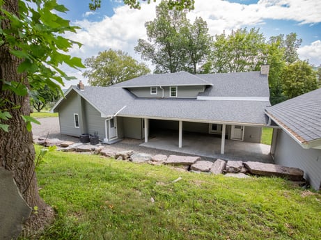 An image featuring plant, cloud, building, sky, window, house, tree, wood, land lot, grass at 17899 US-6.