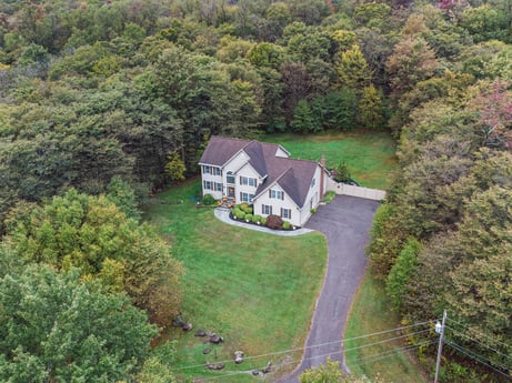 An image featuring plant, natural landscape, building, tree, window, highland, house, land lot, cottage, landscape at 92 Sunrise Dr.