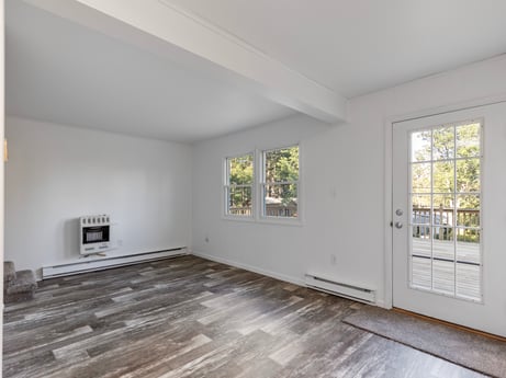 An image featuring window, fixture, wood, interior design, hall, flooring, floor, hardwood, wood stain, ceiling at 127 Shore Dr.