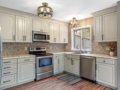 A kitchen at 276 Mountain View Ln featuring: cabinetry, countertop, kitchen stove, building, wood, lighting, home appliance, kitchen appliance, interior design, kitchen
