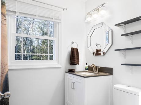 A kitchen at 1061 Muncy St featuring: cabinetry, property, building, window, wood, interior design, kitchen, grey, flooring, drawer