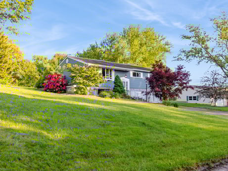 An image featuring sky, cloud, plant, flower, tree, building, natural landscape, land lot, house, cottage at 491 Hillcrest Dr.