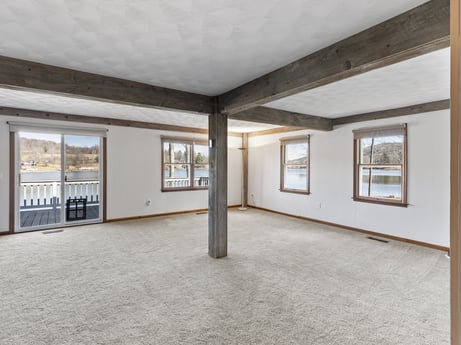 An image featuring fixture, hall, wood, floor, flooring, ceiling, real estate, building, window, glass at 199 S Lake Rd.