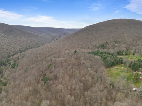 An image featuring cloud, sky, plant, mountain, natural landscape, terrain, formation, landscape, grassland, grass at English Hollow Ln.
