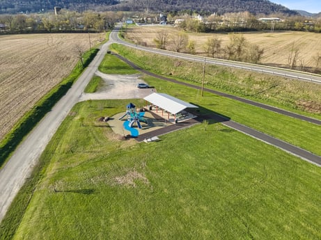 An image featuring plant, sky, land lot, natural landscape, grass, slope, tree, landscape, grassland, plain at River Access Rd.