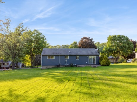 An image featuring cloud, plant, sky, building, property, window, tree, natural landscape, natural environment, house at 491 Hillcrest Dr.