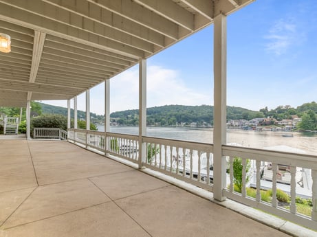 An image featuring sky, property, building, shade, plant, cloud, interior design, house, condominium, porch at 218 Point Rd.