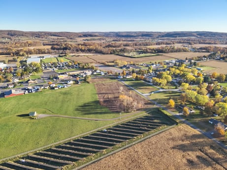 An image featuring sky, plant, ecoregion, land lot, urban design, grass, plain, landscape, tree, grassland at Elm Dr.
