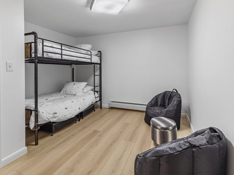 An image featuring comfort, building, fixture, interior design, floor, grey, wood, flooring, bed frame, bed at 104 Stony Mountain Rd.