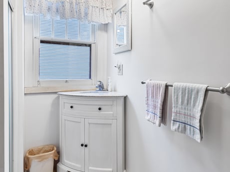 An image featuring cabinetry, property, bathroom cabinet, window, azure, interior design, wood, window blind, floor, grey at 103 Mokoma Ave.