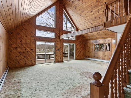 An image featuring window, wood, building, interior design, floor, flooring, beam, wood stain, real estate, hardwood at 815 Lakeside Dr.