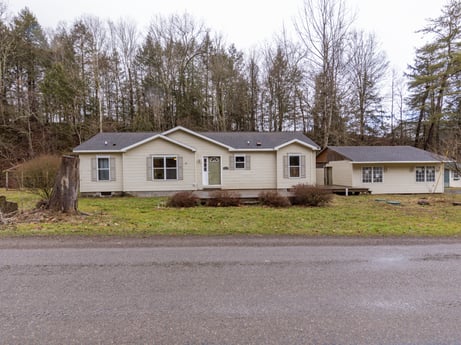 An image featuring plant, window, sky, building, tree, house, land lot, grass, cottage, residential area at 1841 Lynch Rd.