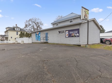 An image featuring sky, cloud, property, window, tire, asphalt, road surface, wheel, tree, building at 199 State St.