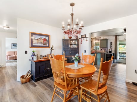 An image featuring furniture, property, table, picture frame, chair, wood, orange, flooring, living room, floor at 105 Thomas St.