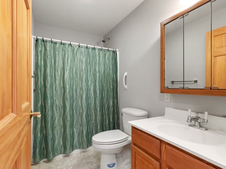 An image featuring mirror, bathroom cabinet, sink, property, tap, plumbing fixture, cabinetry, shower curtain, building, bathroom at 2899 Overton Rd.