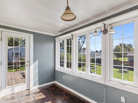 An image featuring property, window, fixture, wood, lighting, interior design, shade, floor, wood stain, wall at 132 Wilbur St.