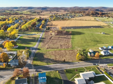 An image featuring plant, sky, land lot, natural landscape, highland, grass, urban design, tree, grassland, plain at Elm Dr.