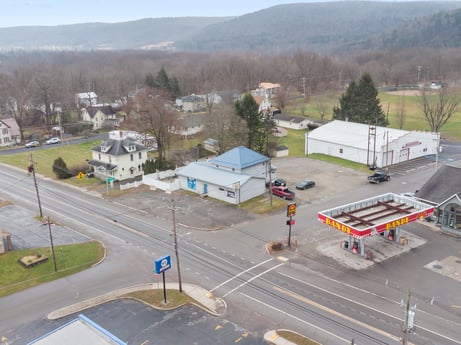 An image featuring building, sky, window, asphalt, tree, mode of transport, house, road surface, urban design, plant at 199 State St.